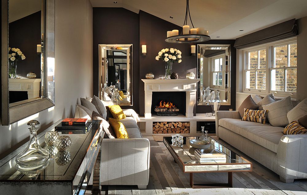Posh living room of London penthouse with cozy fireplace and mirrored decor